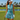 Woman in a visor on a golf course wearing the Cyan Wave Zinnia Golf Sleeveless Top by Hadley Pollet with teal waves