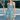 Woman on a tennis court with a racket wearing the Cyan Waves Zinnia Halter Tennis Dress by Hadley Pollet with teal waves