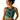 Smiling woman in the Ocean Zinnia Bubbles Athletic Crop Top by Hadley Pollet, light blue and yellow zinnias on deep teal