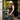 Woman in black on a city sidewalk holding the Purple Peek-A-Boo Clutch by Hadley Pollet, purple cutout over green