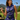 Purple Wave Zinnia Golf Sleeveless Top by Hadley Pollet, purple and navy waves with green zinnias, worn on a golf course