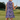 Back view of the Purple Waves Zinnia Sleeveless Tennis Dress by Hadley Pollet, lavender and navy waves, on a golf course